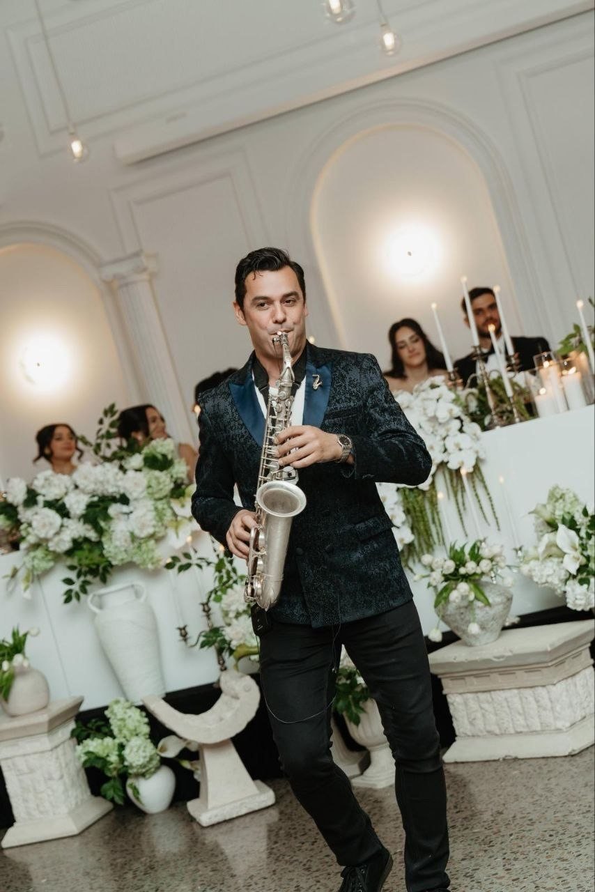 Orget Sax playing solo saxophone at a private celebration